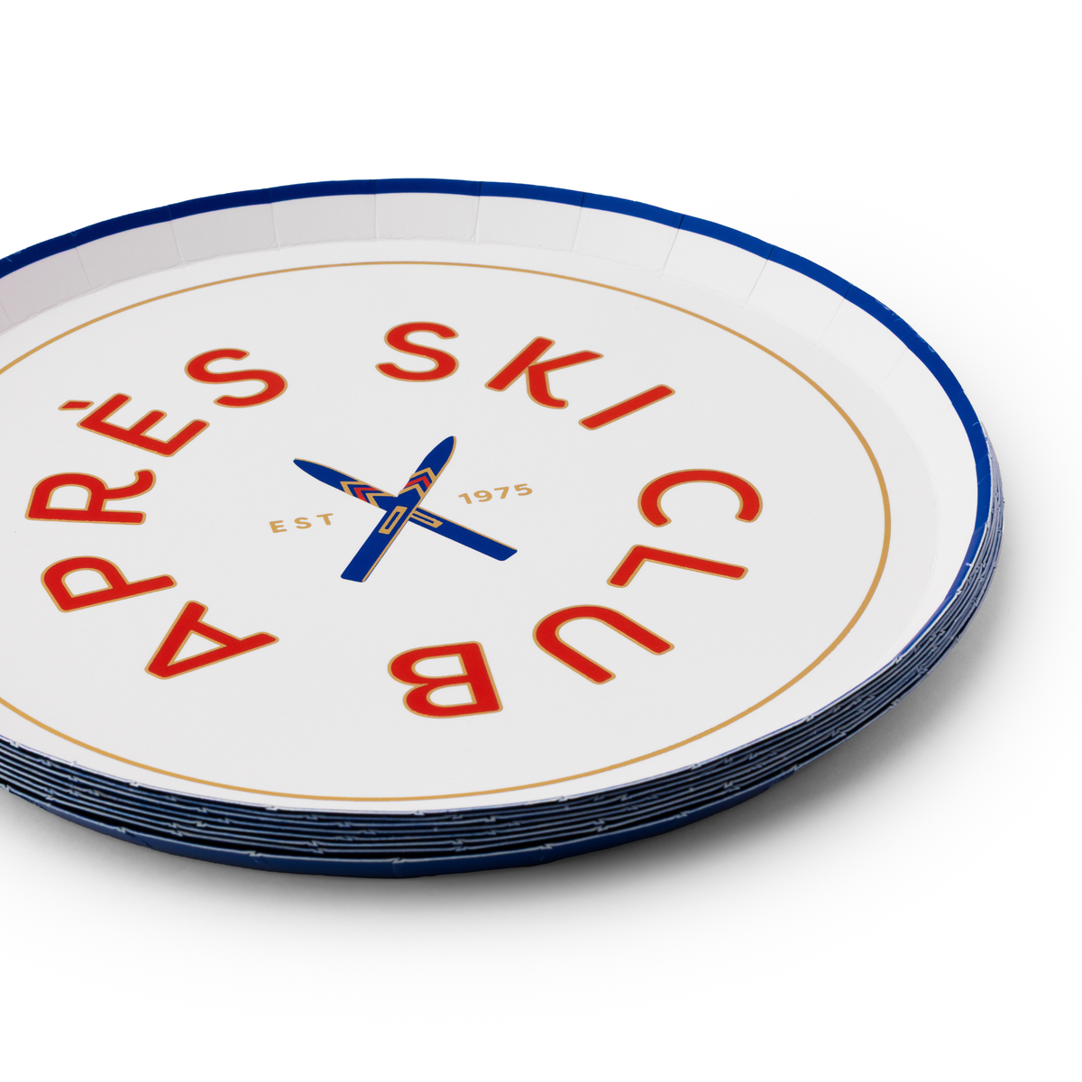 Stack of Après Ski Club small plates with red and blue ski graphic detail
