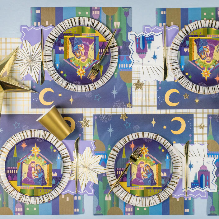Decorative tableware set with nativity scene design on a blue background
