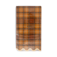 Close-up front packaging of the plaid pattern and decorative cream scalloped edge.