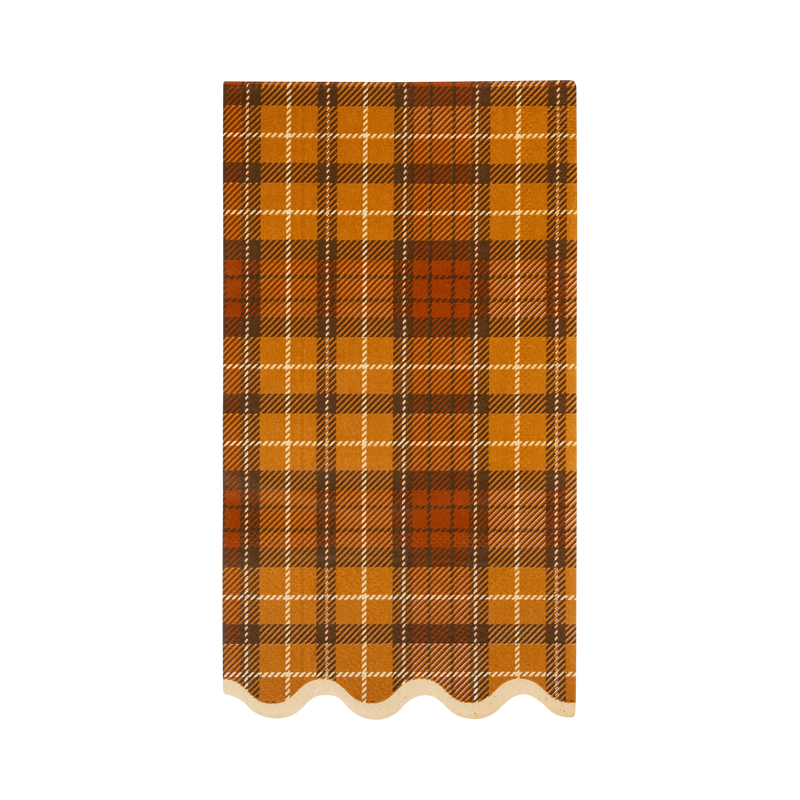 Autumn plaid paper dinner napkins with brown, orange, and cream plaid pattern and cream wavy edge.