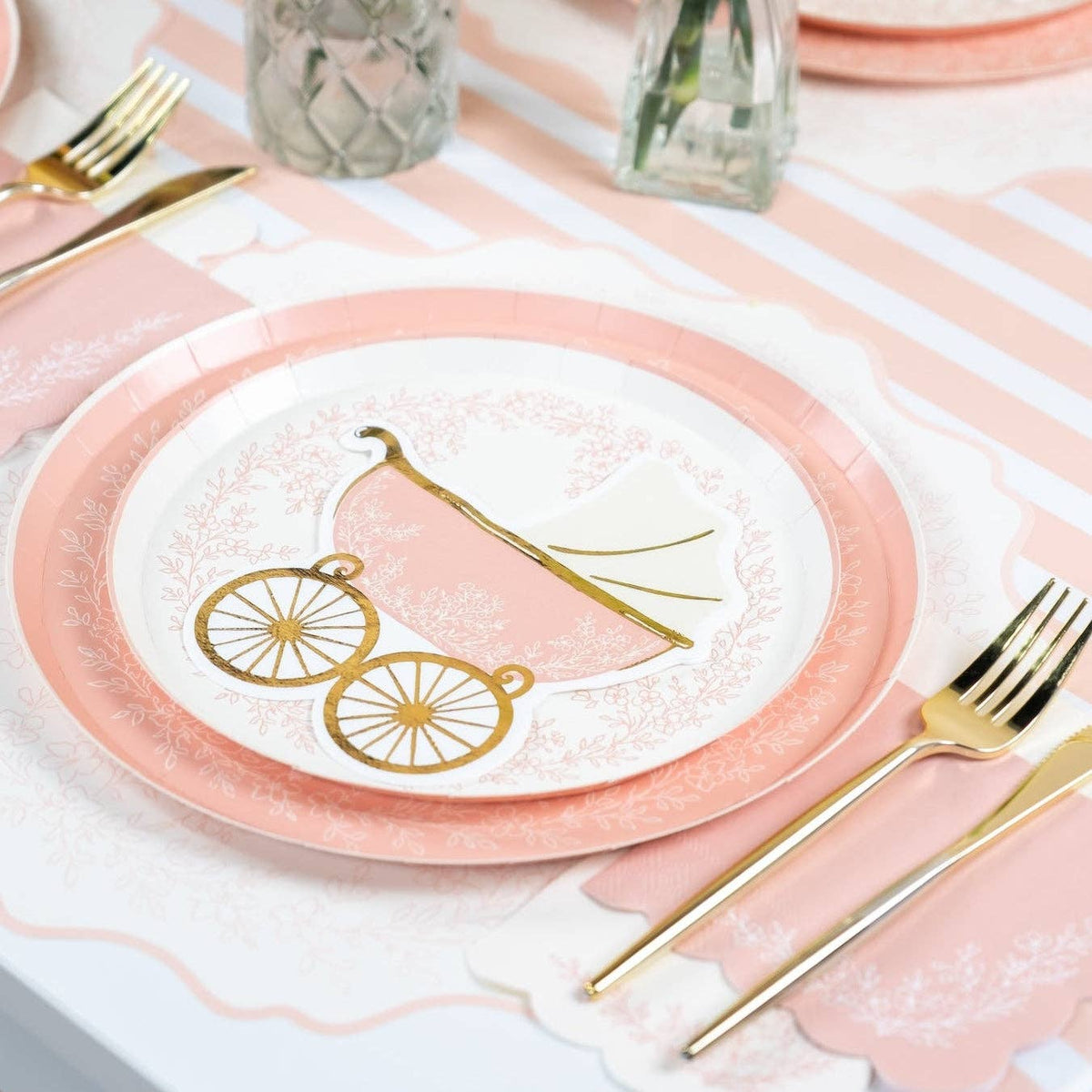 Pink dessert plate with carriage plate and gold cutlery