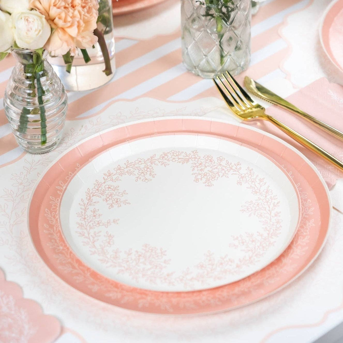 Baby pink striped runner with floral plates and soft pastel table setting