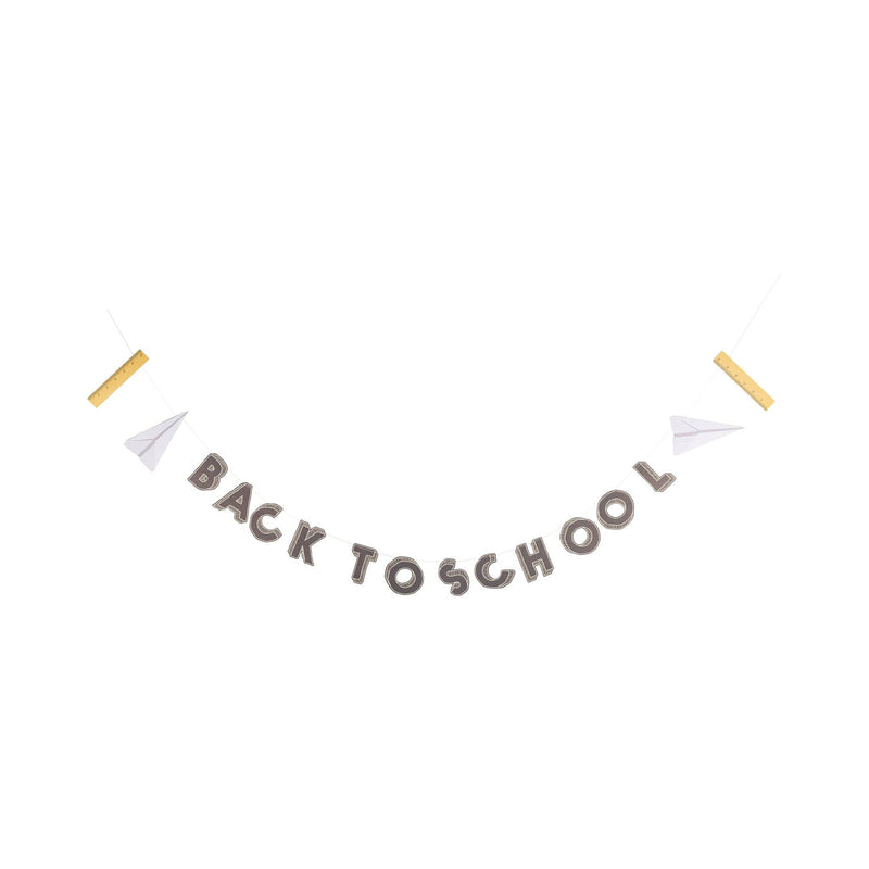 Back to School banner garland strung between paper airplanes and gold rulers, shown hanging on a white background.