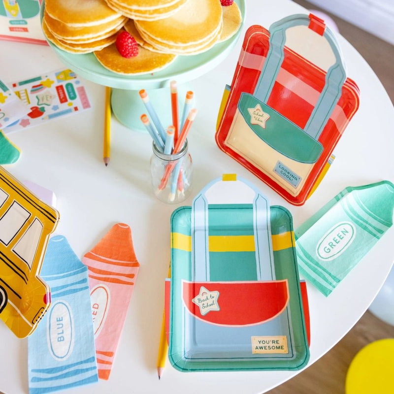 Back to school party table with crayon napkins and plates.