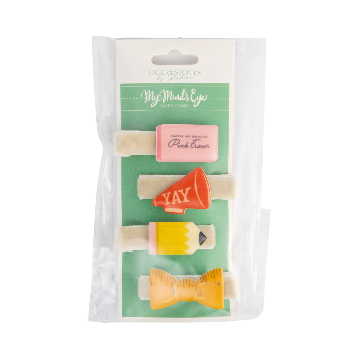 Front of back to school hair barrette set in packaging showing four clips — pink eraser, red YAY megaphone, yellow pencil, and yellow ruler bow — on cream velvet bases
