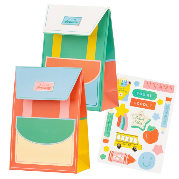 Backpack-shaped treat bags in colorful school-themed design with flap closure.