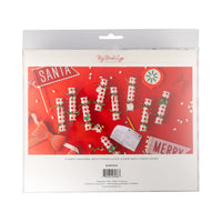 Back of the package detailing the contents of the 12 Christmas crackers poppers (dice, game, crown).