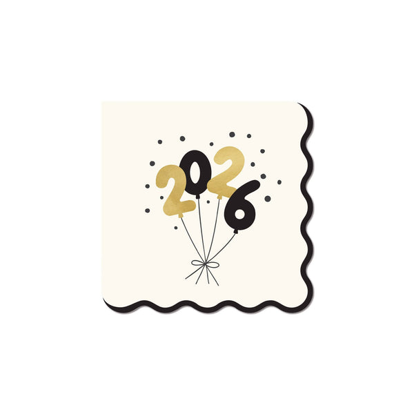 A cream scalloped cocktail napkin with a bundle of black and gold balloons spelling out the Gold Year 2026.