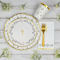 baptism table setting with eucalyptus plates and gold fork
