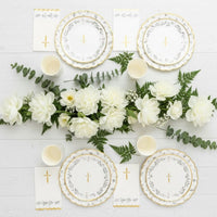 top view of baptism party table with matching plates and decor
