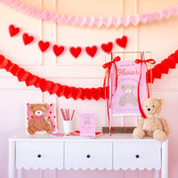 valentine party table with teddy bear plate and decor