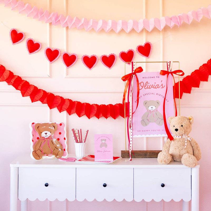 valentine party table with teddy bear plate and decor