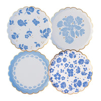 Product grid showing four Belle Blue floral dessert plate designs with gold scalloped rims.