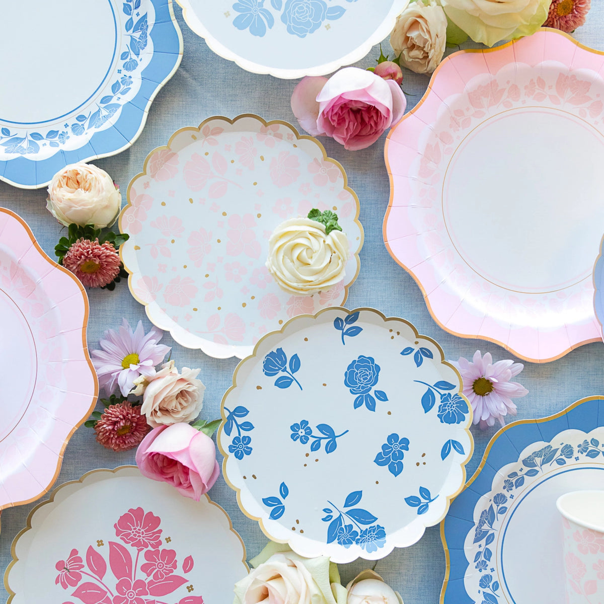 Assorted Belle Blue dessert plates styled with roses and cupcakes—perfect boy baby shower plates or tea party table.