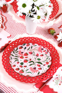 Strawberry Paper Plates arranged with fresh daisies and strawberries for a Berry First Birthday celebration.