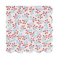 Single berry vine floral paper cocktail napkin flat lay showing red berries and blue leaves on cream with scalloped edge