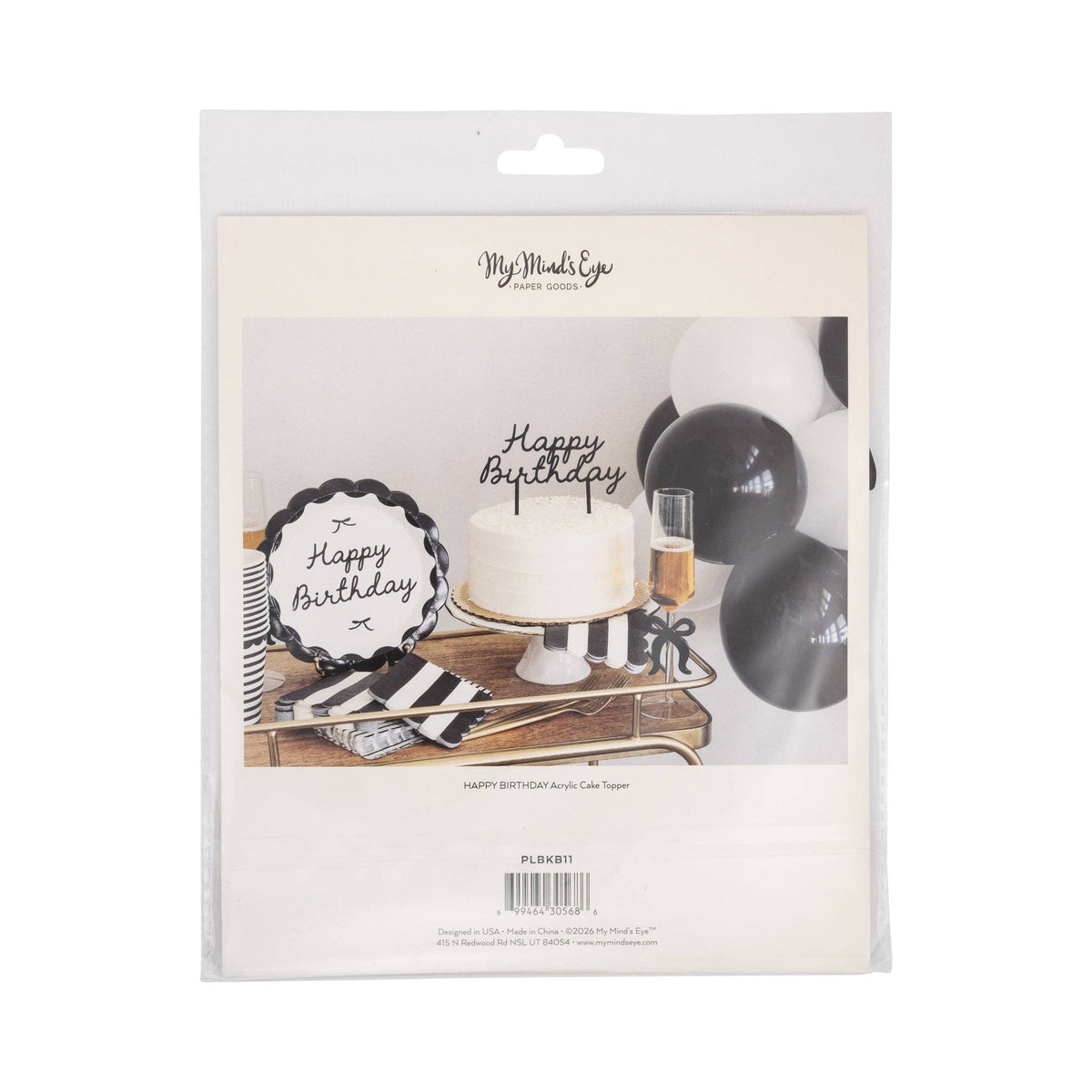  Black acrylic Happy Birthday cake topper in retail packaging showing matte black script and black and white styled party scene