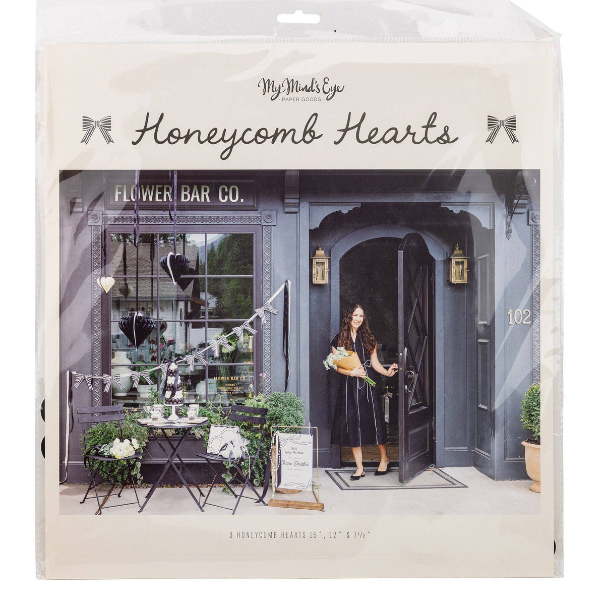 Black and white honeycomb hanging hearts set of three shown in original packaging