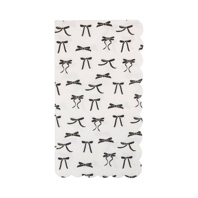 Black Bow Guest Napkin Single — White guest napkin with black bow pattern and scalloped edge, studio image.