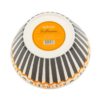 Black and cream Halloween snack bowl with Happy Halloween lettering around the rim, bottom view.