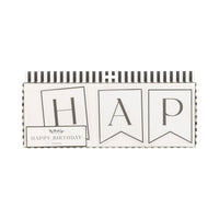 Black and cream Happy Birthday banner in retail box showing die-cut pennant letters with serif typography and black and white striped packaging
