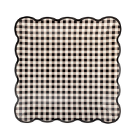 Cream-and-black gingham square paper plate with a wavy black edge, front view.