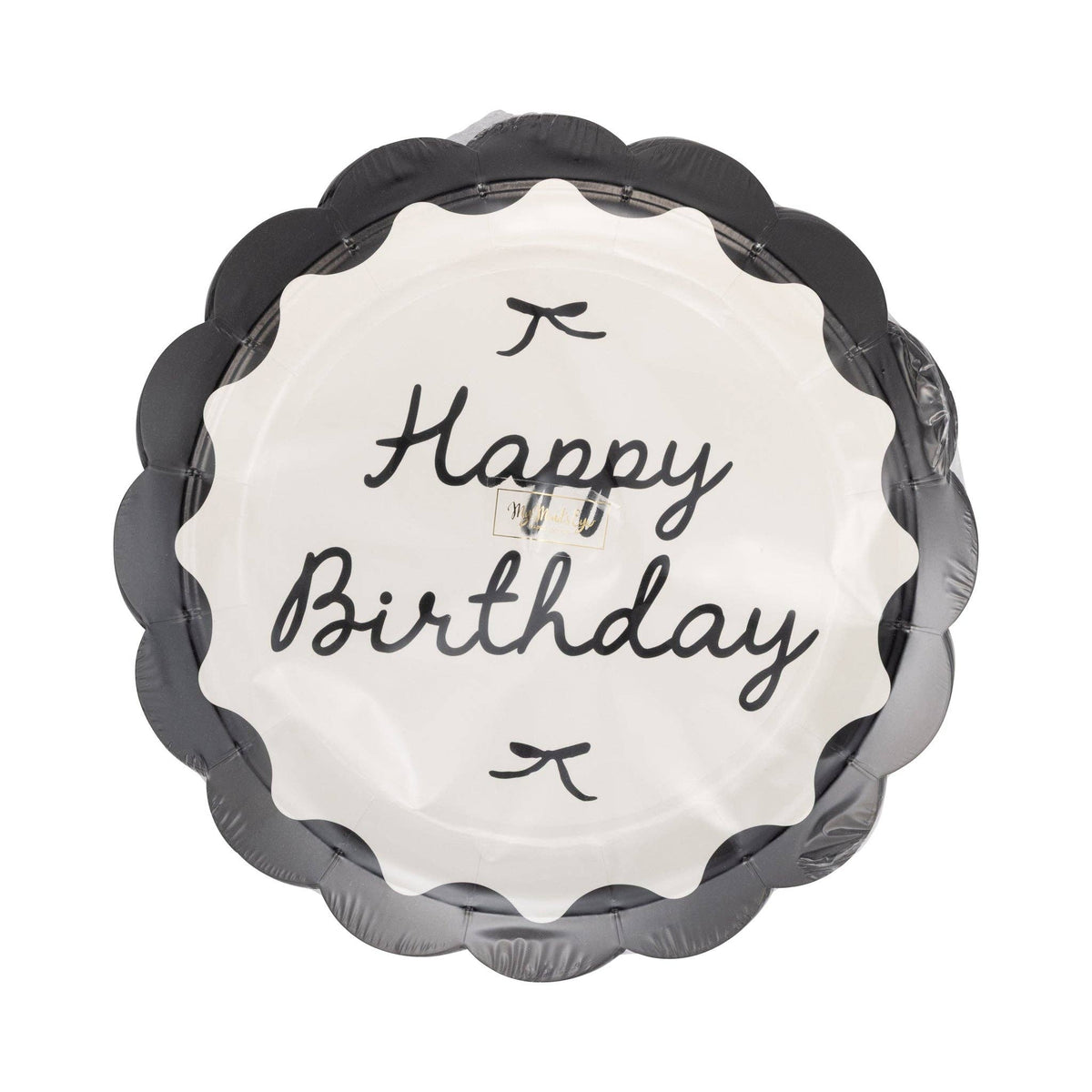 Stack of black and cream Happy Birthday scalloped dinner plates in clear retail packaging showing cursive script and bow details on white background