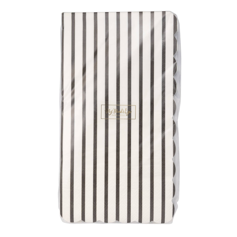 Front view of black and white pinstripe paper guest towels in clear retail packaging showing My Mind's Eye gold logo label