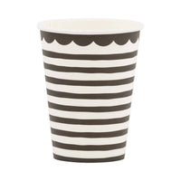 Single black and white striped paper cup showing horizontal stripe pattern and black scalloped rim detail on white background