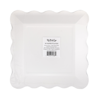 Packaging of the back of a paper plate with a scalloped edge on a clear wrap with a label.