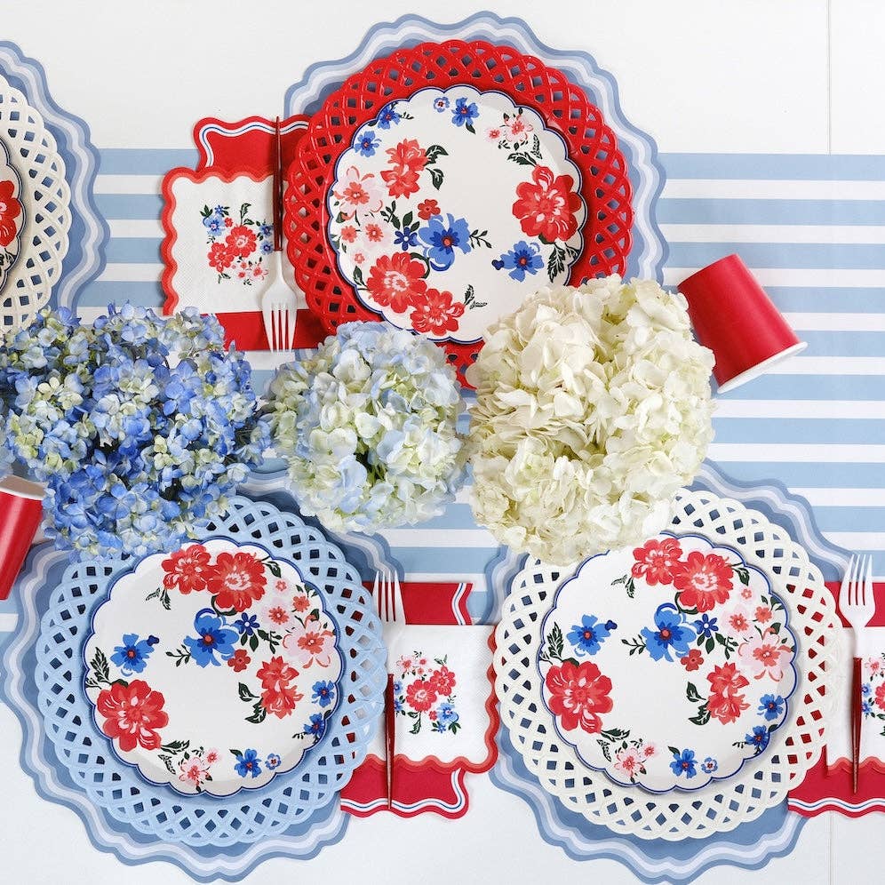 Summer Floral Paper Plates layered on lattice chargers for a Coastal Grandmother 4th of July aesthetic.