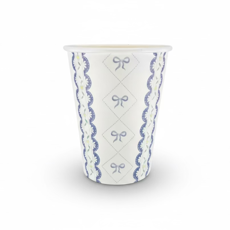 Single paper party cup with blue bow lattice and floral lace pattern
