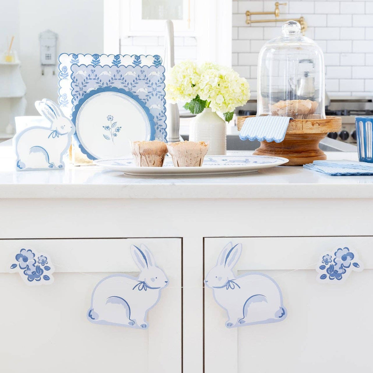 Close-up of blue bunny garland decorating kitchen cabinets for Easter.