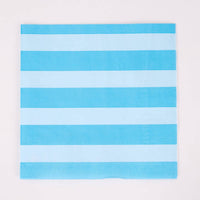 Single blue and white cabana stripe paper lunch napkin flat on white