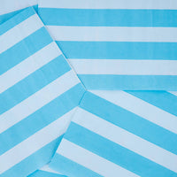 Close-up of overlapping blue and white striped paper lunch napkins