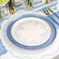 blue floral placemats styled with tableware and floral centerpieces.