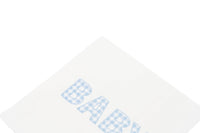 Close crop of the corner of a blue gingham BABY paper napkin showing the check print detail
