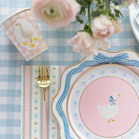 Close-up of blue bow dinner plate with gold foil edge