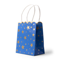 Blue favor bag, three-quarter view, covered in gold-foil stars with a scalloped top and white twisted-paper handles.