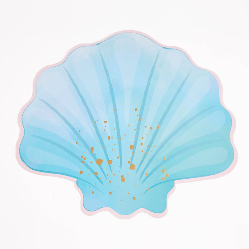 Single blue seashell shaped paper placemat on a white background showing the full scallop shell shape, gold foil, and pink edge.