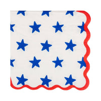 Blue star print scalloped paper cocktail napkin on cream background with red scalloped edge
