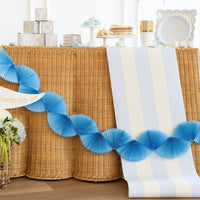 Blue striped table runner displayed on a baby shower dessert table with blue decorations