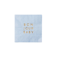 Single sky‑blue cocktail napkin photographed flat to show gold‑foil text and subtle texture.