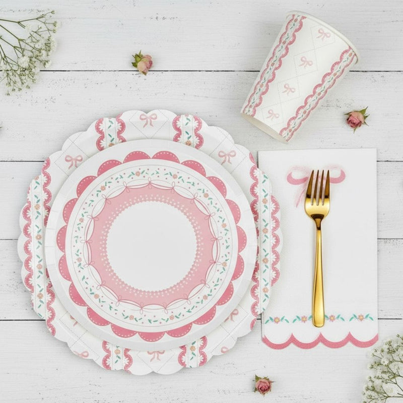 Layered place setting with a small lace plate on top of a large bow plate