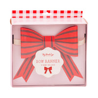 Packaged bow banner with red striped bow design in box