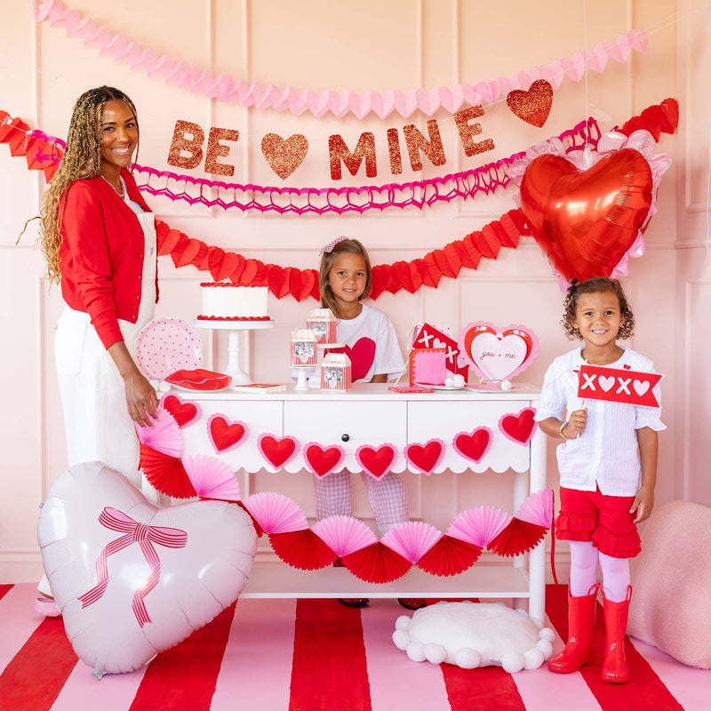 Bow heart mylar balloon displayed at a Valentine-themed party table