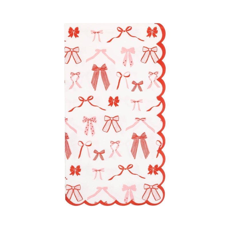 Bow pattern dinner napkin with red and pink bows and scalloped edge