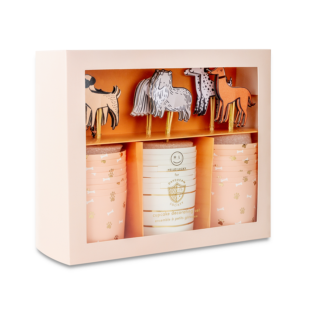 Side view of dog cupcake decorating kit box showing illustrated puppy designs