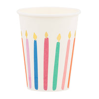 A single white paper cup from our Bright Birthday party cups set featuring colorful candles with gold foil flames.