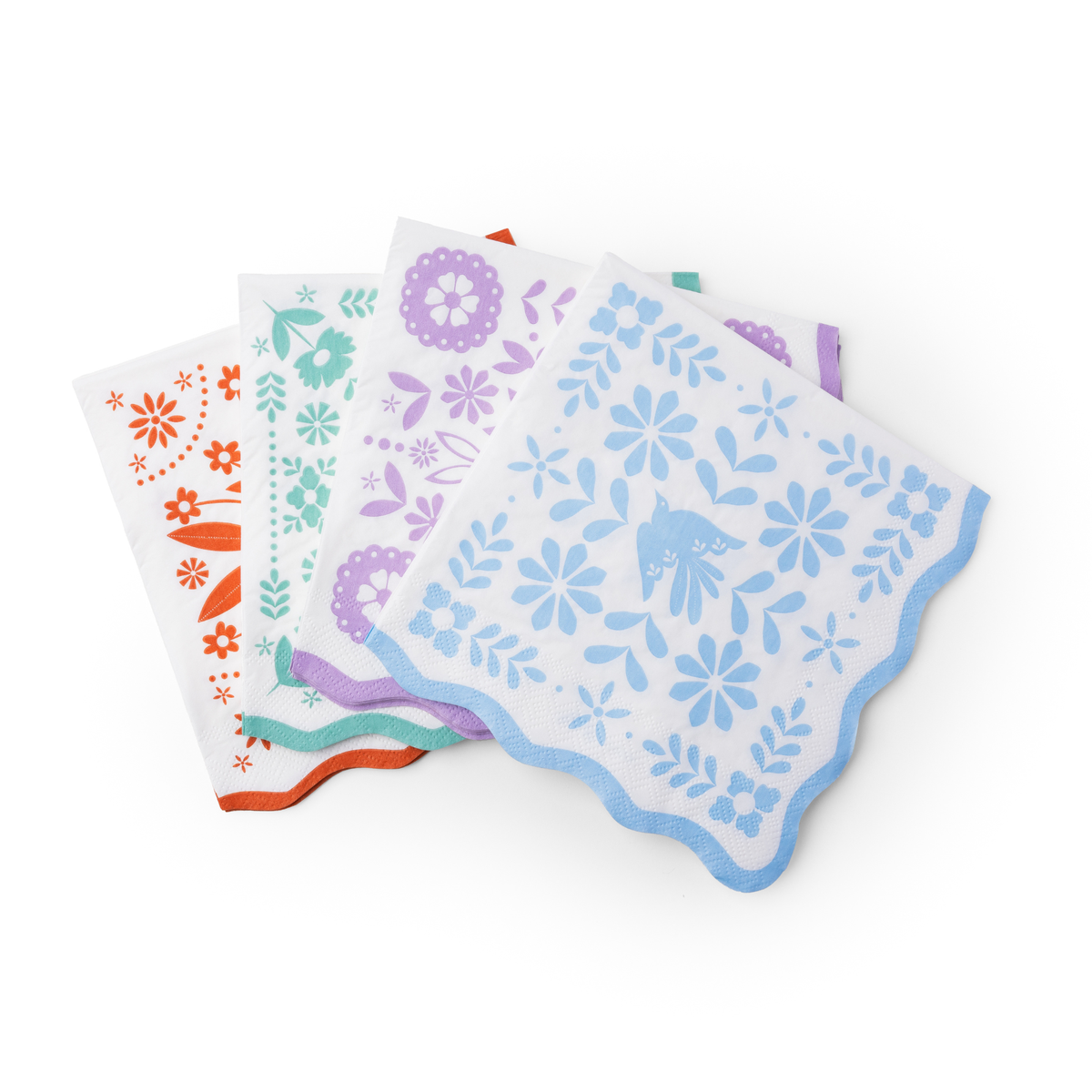bright fiesta paper napkins with colorful floral designs and scalloped edges
